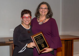 Cheryl Leanza presents Gigi Sohn with Parker Award plaque.